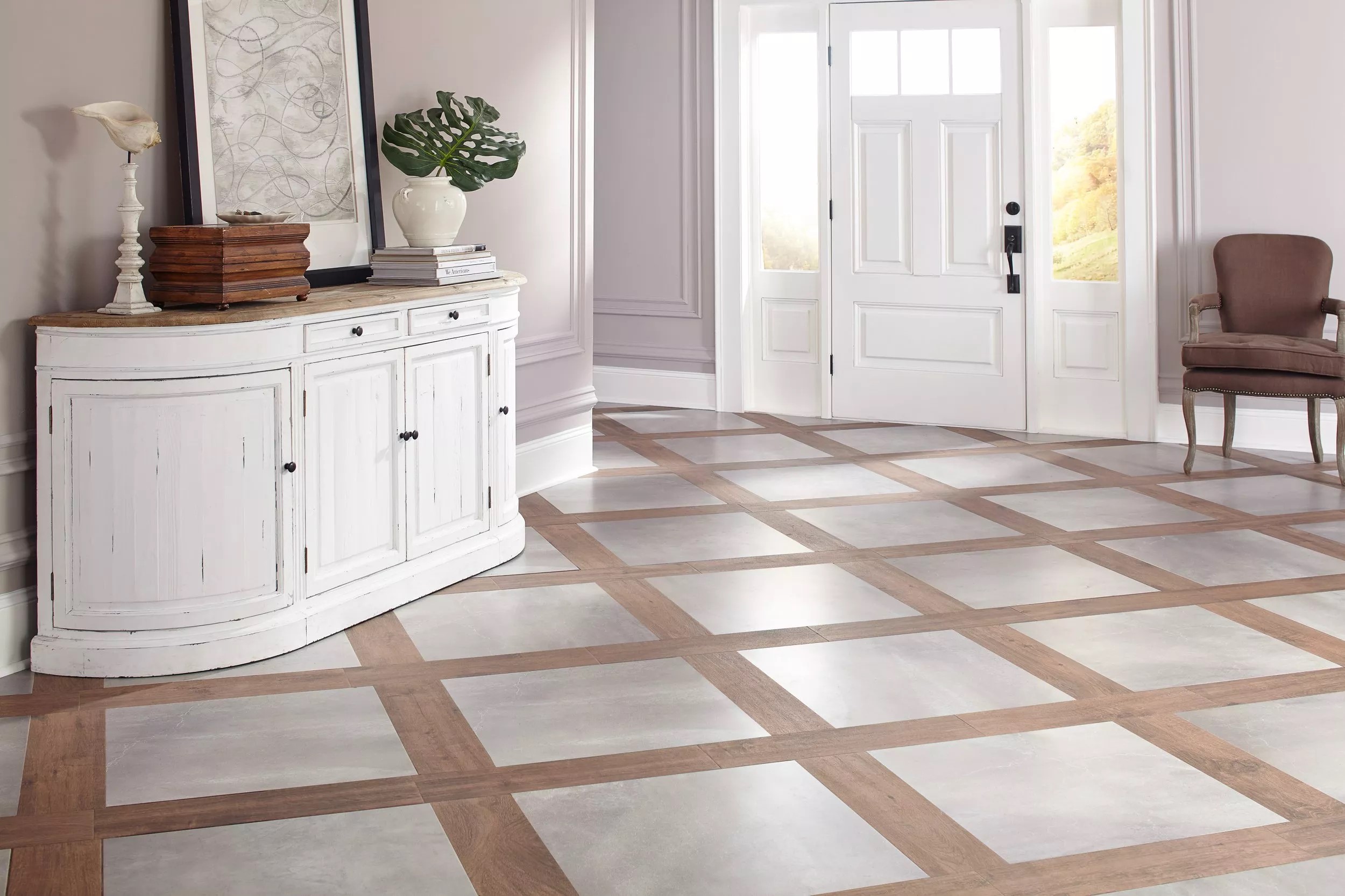 about-img-01 A decorative entryway with a floor featuring a checkerboard pattern of light ceramic tiles and brown wood planks.